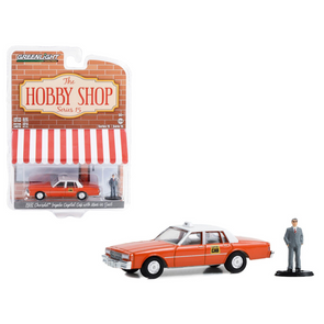 1981-chevrolet-impala-capitol-cab-taxi-orange-with-white-top-and-man-in-suit-figure-the-hobby-shop-series-15-1-64-diecast-model-car-by-greenlight