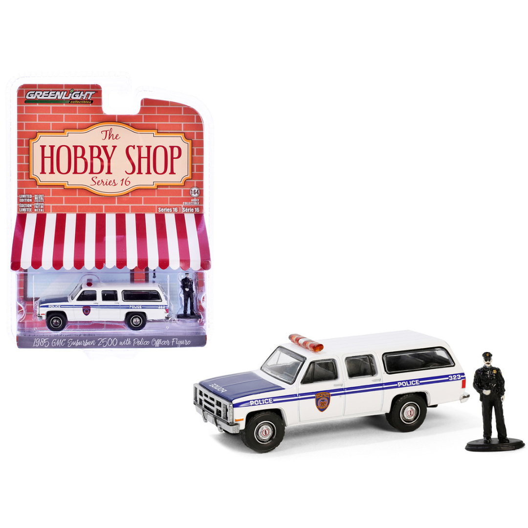 1985 GMC Suburban 2500 "New York City Transit Police Department" White with Blue Stripes and Police Officer Figure "The Hobby Shop" Series 16 1/64 Diecast Model Car