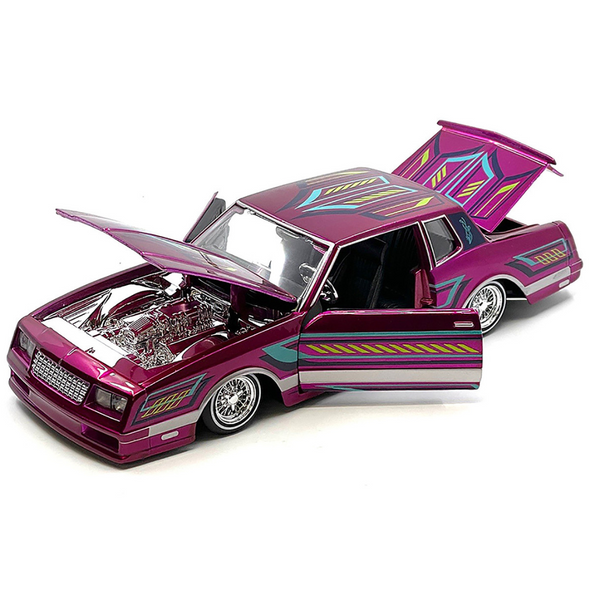 1986 Chevrolet Monte Carlo SS Lowrider Pink Metallic with Graphics "Lowriders" Series 1/24 Diecast Model Car