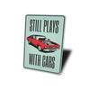 still-plays-with-cars-aluminum-sign